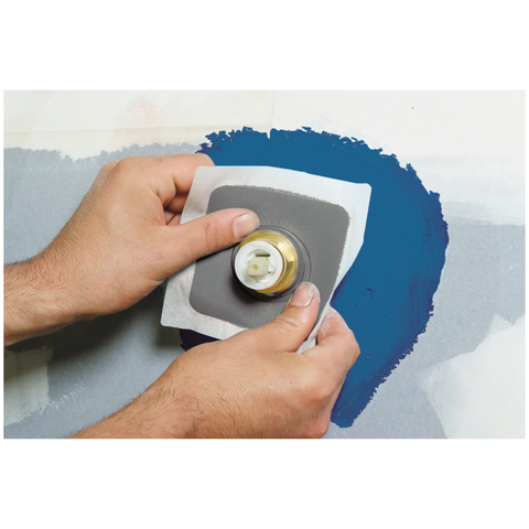 Hands bedding Gripset Elastoproof Collar around pipe into wet waterproofing membrane for watertight, elastic penetration s...