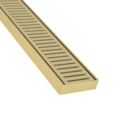 Anodised aluminium NXT26 linear grate in Matte Gold: 26mm deep, anti-tracking prevents under-tile migration with waterproo...