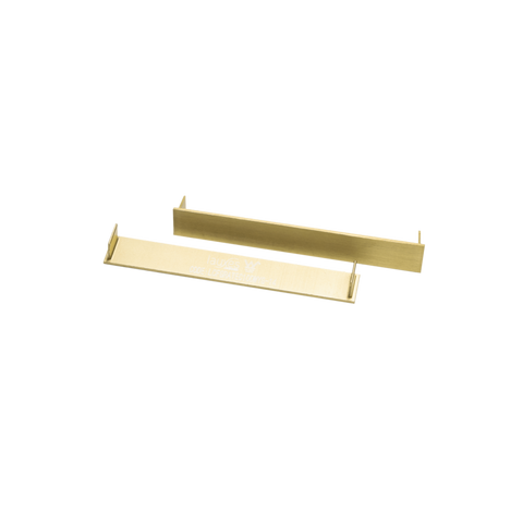 Pair of elegant gold metal shelf brackets with L-shaped flanges for sturdy shelving support.